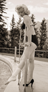 Marilyn Monroe on crutches in a bikini